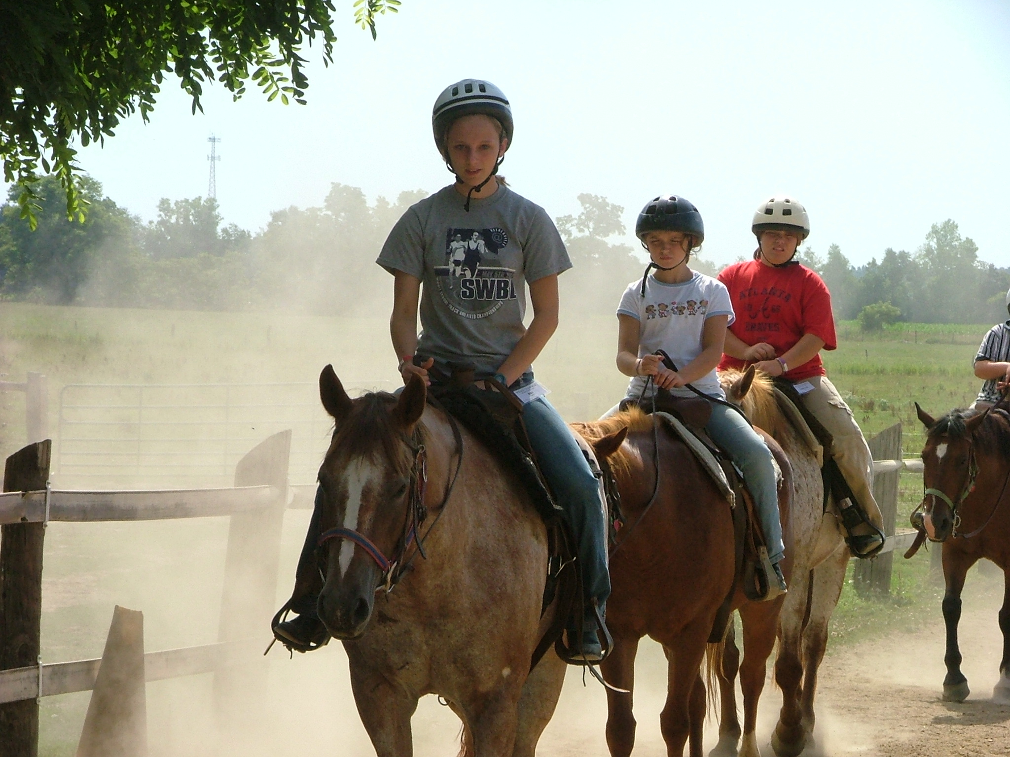 Kids on dusty trail ride