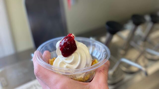 trackside icecream being served with strawberry topping
